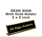 Shown here is a 2x8 Engraved Sign including a Gold slide in Desk holder.