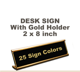 Shown here is a 2x8 Engraved Sign including a Gold slide in Desk holder.