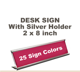 Shown here is a 2x8 Engraved Sign including a Silver slide in Desk holder.