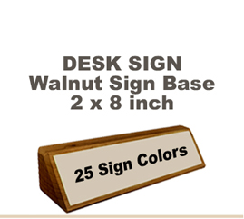 Shown here is a 2X8 Engraved Sign including a hand rubbed Walnut Desk holder.